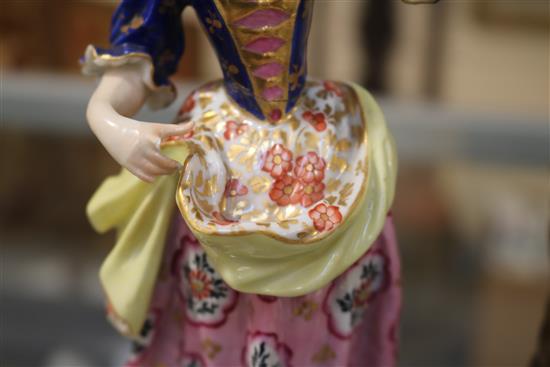 A Samson Derby figure of a lady and a pair of Paris porcelain figures